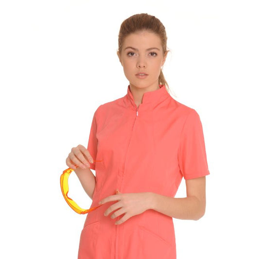 Woman wearing a coral-colored short-sleeve shirt on a white background